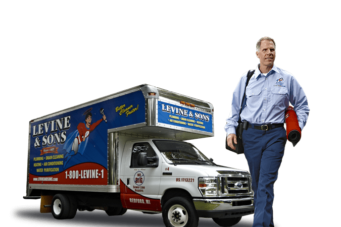 Man In A Uniform Walking With A Tool Bag Next To A Levine &Amp; Sons Branded Plumbing And Heating Truck.